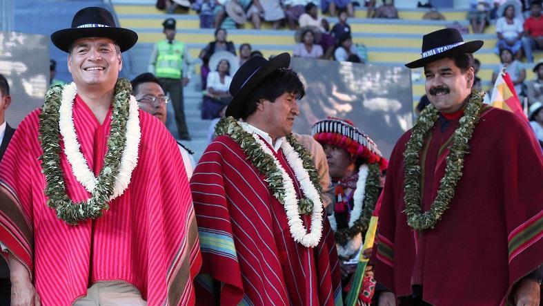Ecuadorean President Rafael Correa (L), Bolivian President Evo Morales (C), and Venezuelan President Nicolas Maduro (R) greet the crowd at the climate change summit in Bolivia on Oct. 12, 2015.