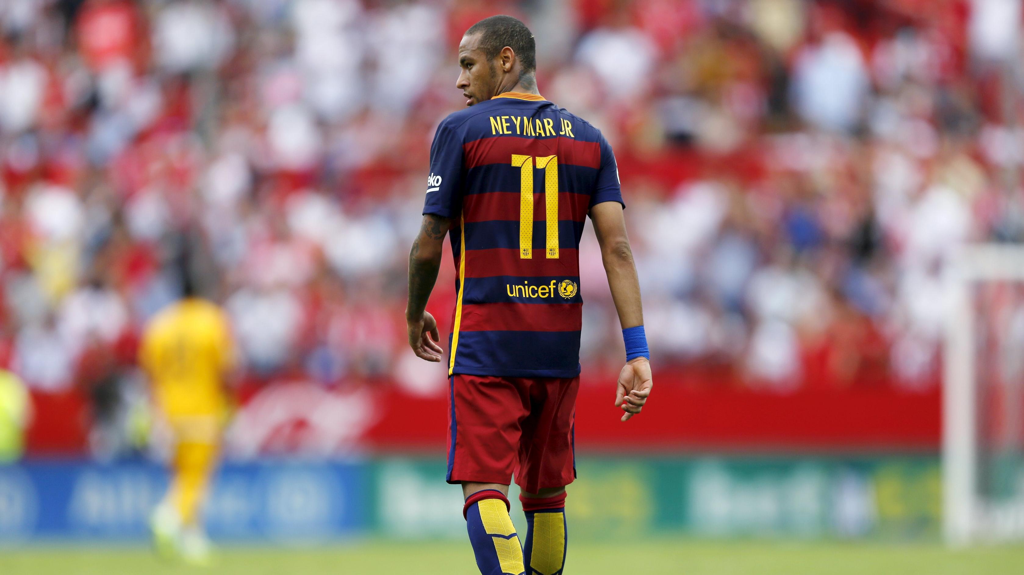 Barcelona's Neymar walks during their Spanish first division soccer match against Sevilla.