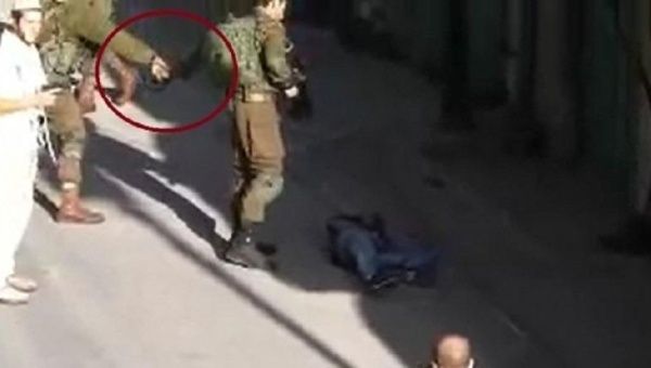 This video has raised concerns about a solider possibly planting evidence on a slain Palestinian.