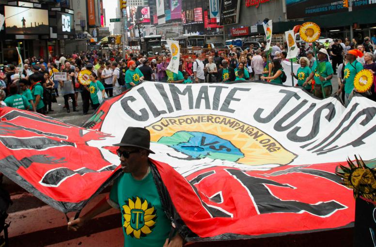 People march during a rally against climate change in New York City, Sept. 21, 2014.