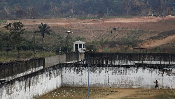 An inmate walks through a prison courtyard at a complex of ten prisons in Porto Velho, Rondonia State, Brazil, Aug. 28, 2015.