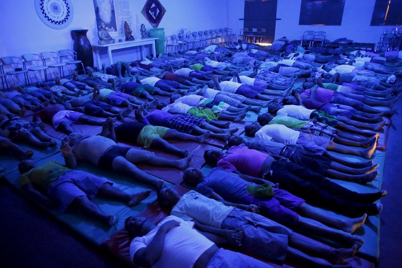 Inmates do yoga stretches and breathing exercises as part of the ACUDA program, at a complex of ten prisons in Porto Velho, Rondonia State, Brazil, Aug. 28, 2015.