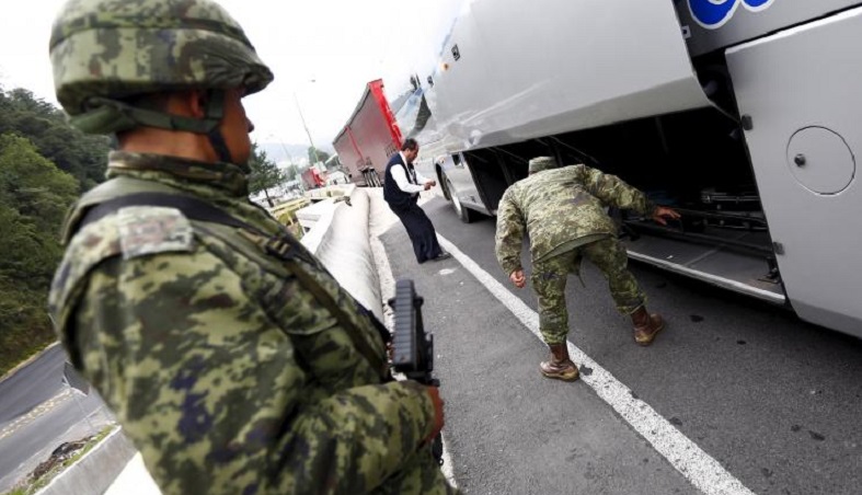 Really? Mexica military searches for El Chapo in luggage compartments.
