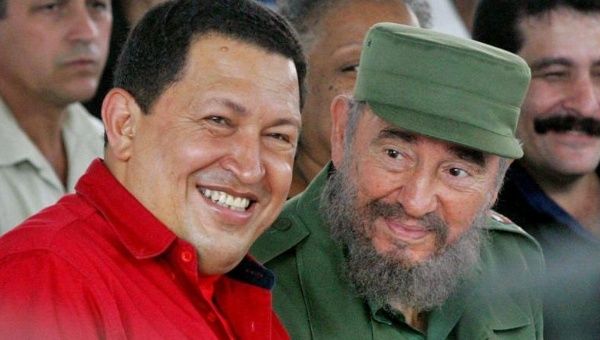 The presidents of Cuba and Venezuela, Fidel Castro (R) and Hugo Chavez (L), signed the agreement Oct. 30, 2000.
