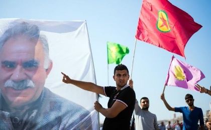 A giant picture of leader Abdullah Ocalan is seen during a demonstration in support of Kurdish forces fighting the Islamic State group.