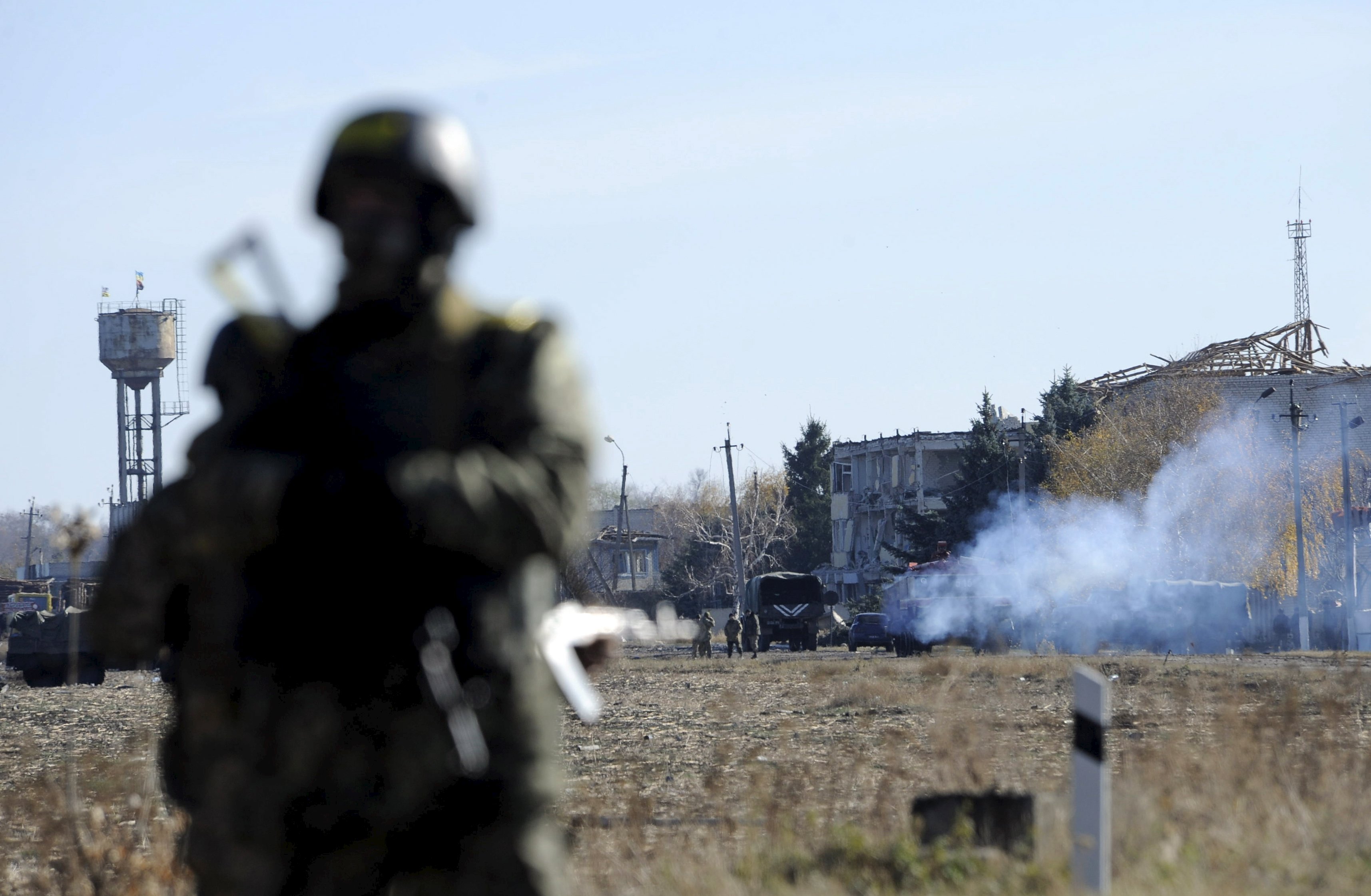 Ukrainian government troops near a military depot. Ukraine's civil war has left over 8,000 people dead.