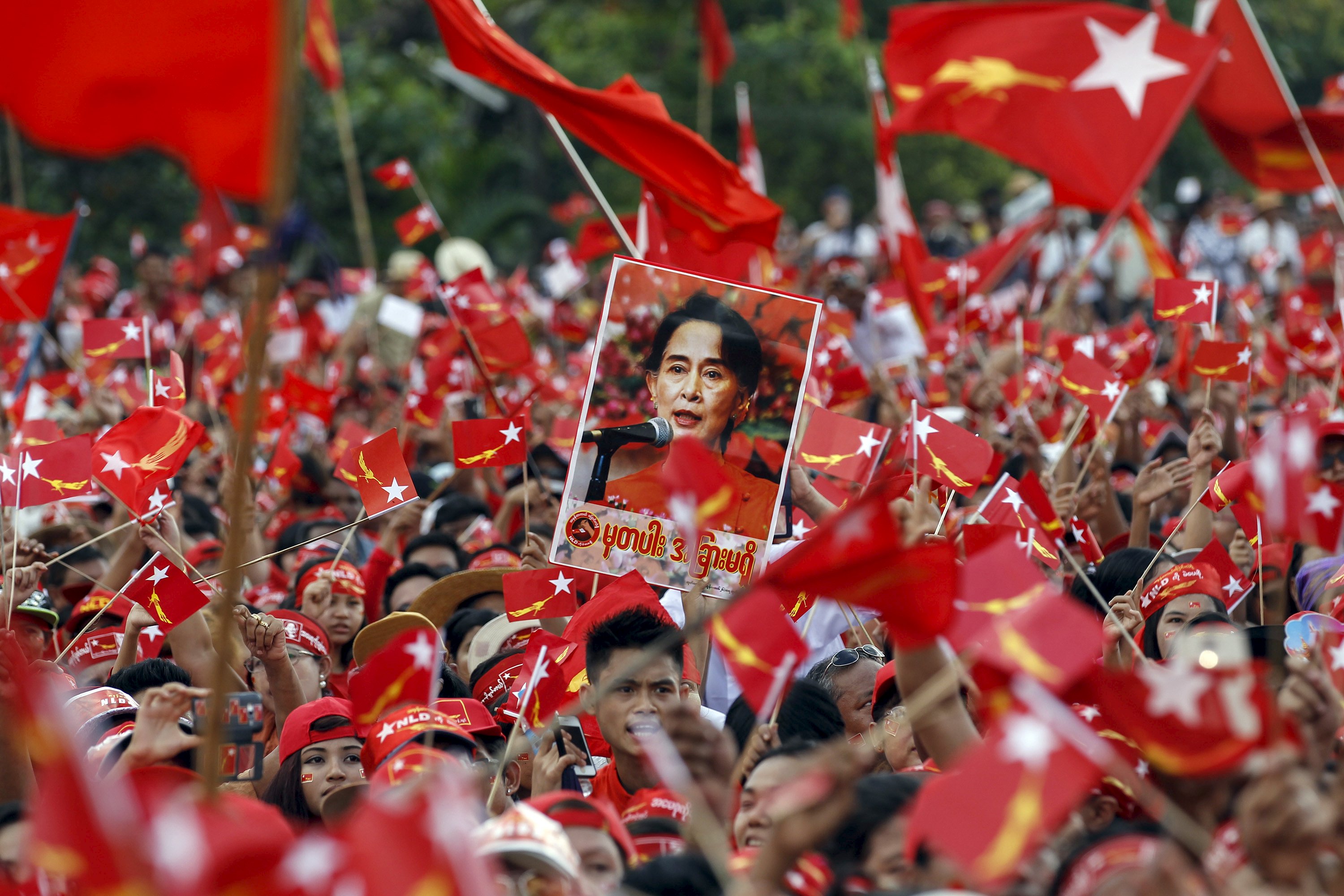 Supporters react as Myanmar pro-democracy leader Aung San Suu Kyi gives a speech at her campaign rally for the upcoming general elections in Yangon Sunday.