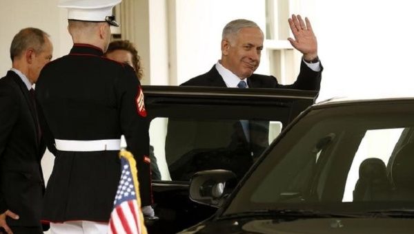 Israel's Prime Minister Benjamin Netanyahu waves as he departs the White House after his meeting with U.S. President Barack Obama, in Washington Oct. 1, 2014.