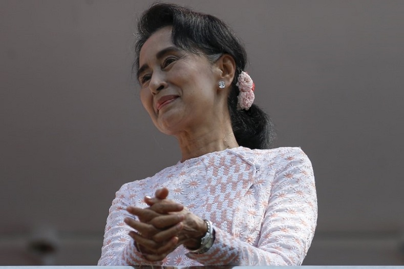 Myanmar's National League for Democracy party leader Aung San Suu Kyi looks at supporters after speaking in Yangon, Myanmar Nov. 9, 2015.