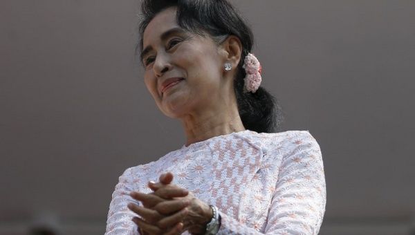 Myanmar's National League for Democracy party leader Aung San Suu Kyi looks at supporters after speaking in Yangon, Myanmar Nov. 9, 2015. 