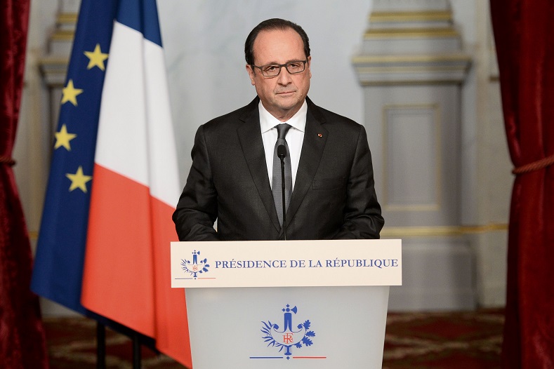 French President Francois Hollande speaks at the Elysee Palace in Paris, France, the day after a series of deadly attacks in the French capital, Nov. 14, 2015