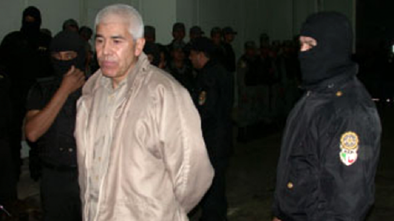 Rafael Caro Quintero, another of Mexico's most powerful drug lords, being escorted out of jail in August 2013.