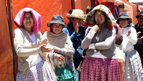 Aymara women stand at a fair held on the side of the Cholita fashion show at Villa Esperanza.