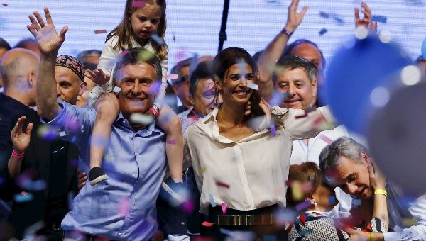 Mauricio Macri carries his daughter Antonia on his shoulders next to his wife Juliana Awada  after the presidential election in Buenos Aires, Argentina, Nov. 22, 2015.
