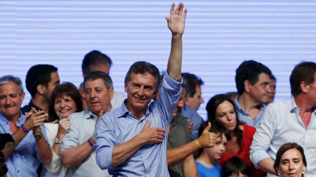 Mauricio Macri, presidential candidate of the Cambiemos (Let's Change) coalition, waves to his supporters after the presidential election in Buenos Aires, Argentina.
