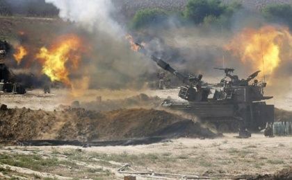 Israeli mobile artillery bombards the Gaza Strip during a 2014 offensive that left over 1,500 people dead, mostly Palestinian civilians.
