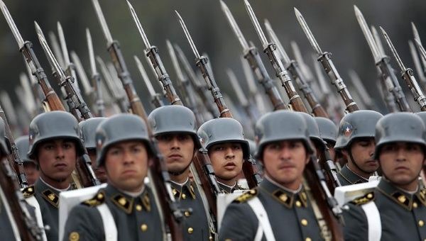 Chilean Army troops march during the a military parade in O'Higgins Park in Santiago, Chile, Sept. 19, 2015.