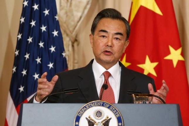 China's Foreign Minister Wang Yi delivers remarks before his meeting with U.S. Secretary of State John Kerry at the State Department in Washington Oct.1, 2014.