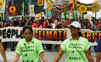 People take part in a climate march in New York on Sept. 21, 2014.