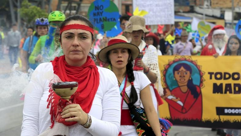 Activists march ahead of the Paris COP21 climate summit in Bogota, Colombia Nov. 29, 2015.