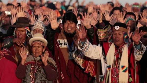 Bolivia’s President Evo Morales celebrates the sunrise during a winter solstice ceremony in Tiwanaku, on June 21, 2011.