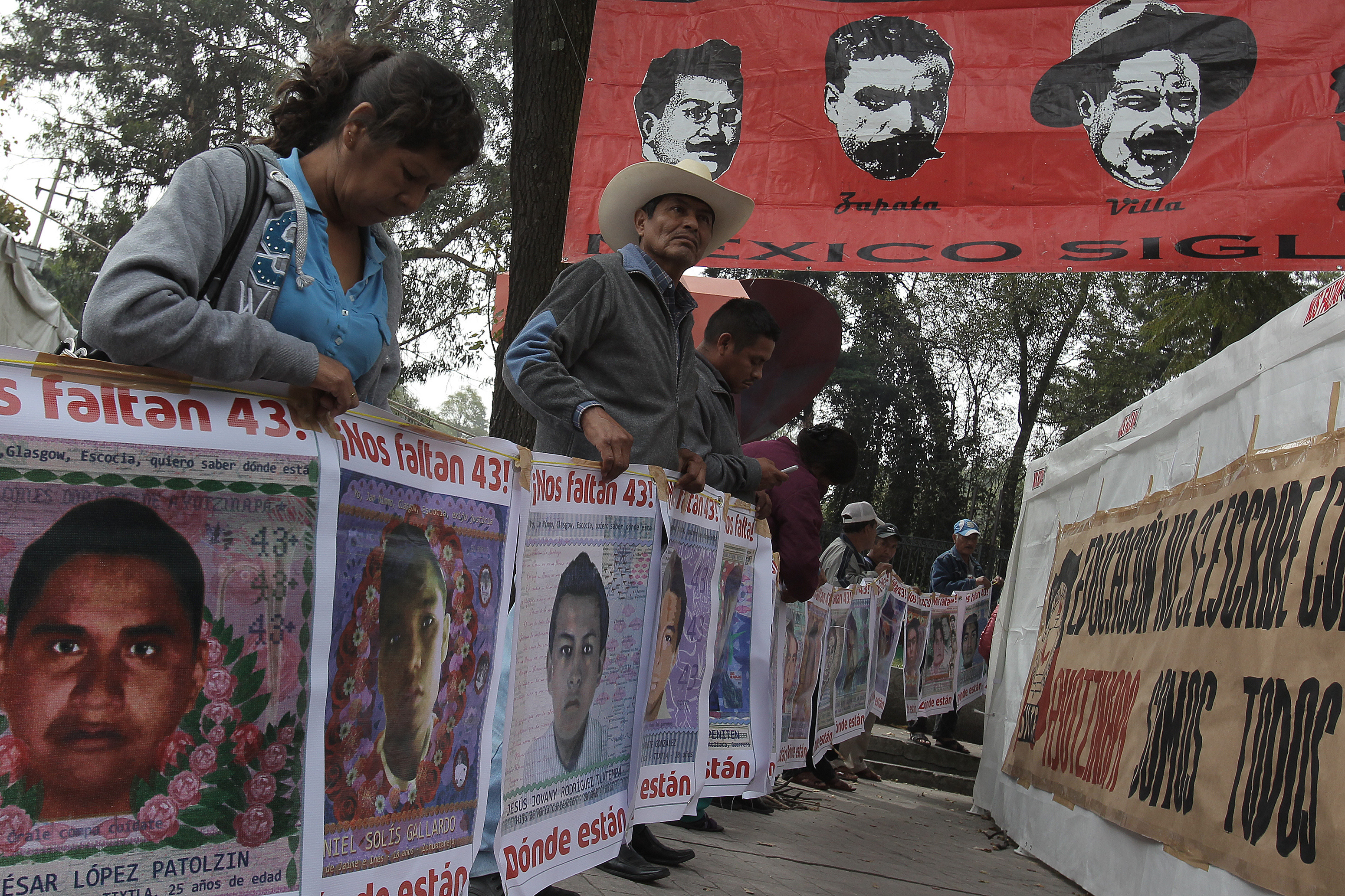 Relatives and friends of the 43 disappeared Ayotzinapa students during a sit-in protest November 27, 2015, near the presidential residence in Mexico City
