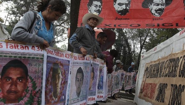 Relatives and friends of the 43 disappeared Ayotzinapa students during a sit-in protest November 27, 2015, near the presidential residence in Mexico City
