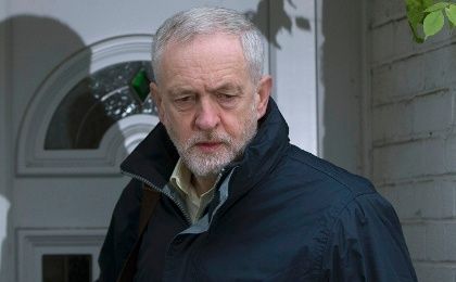 Britain's opposition Labour Party leader Jeremy Corbyn leaves in home in north London, Britain Nov. 30, 2015.