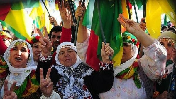 Kurdish women wave PKK flags as they celebrate Nowruz, the Persian new year. 