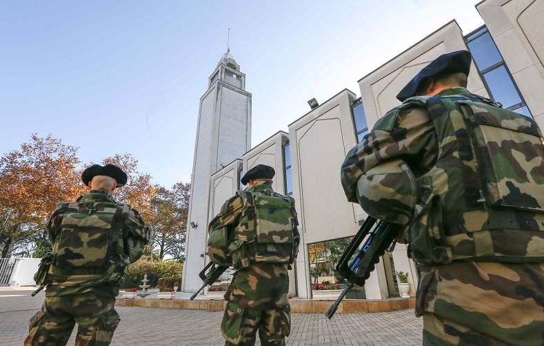 French paratroopers patrol outside the Great Mosque in Lyon, France.