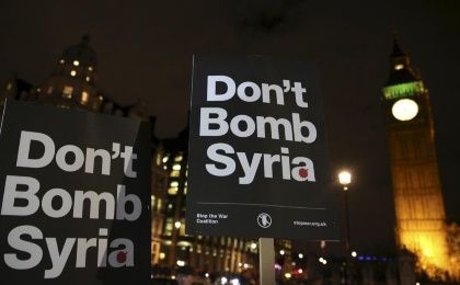 Anti-war protesters demonstrate against proposals to bomb Syria outside the Houses of Parliament in London, Dec. 1, 2015