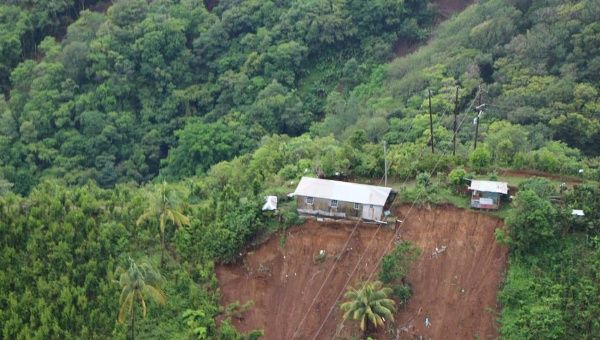 House in Dominica perched precariously after Tropical Storm Erika. Caribbean Leaders say climate change is already wreaking havoc on small islands. 