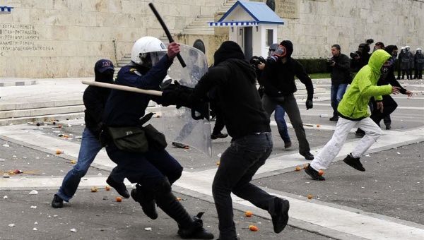 Police clash with protestors on Syntagma Square, Dec. 6, 2015.