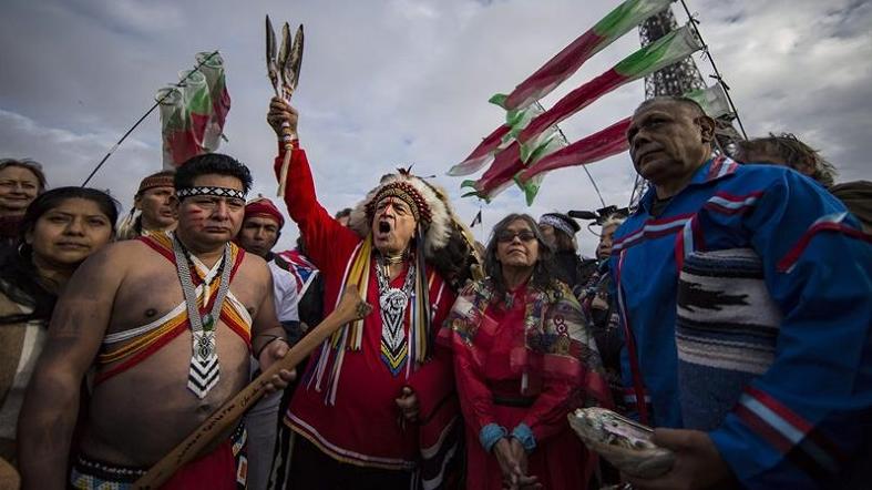 Indigenous leaders from around the world demonstrate in Paris alongside COP21 to draw attention to the plight of indigenous communities facing climate change.