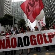 People with a banner that reads “No to the coup” attend a protest against the impeachment proceedings against President Dilma Rousseff, Dec. 8, 2015.