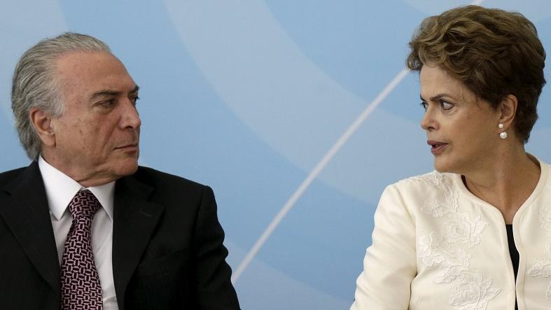Brazil's Vice President Michel Temer (L) talks with President Dilma Rousseff during a ceremony at the Planalto Palace in Brasilia, Brazil, Nov. 24, 2015.