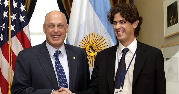 A file photo of former U.S. Treasury Secretary Henry Paulson (L) with Argentina's then-finance minister and soon-to-be ambassador to the U.S., Martin Lousteau.