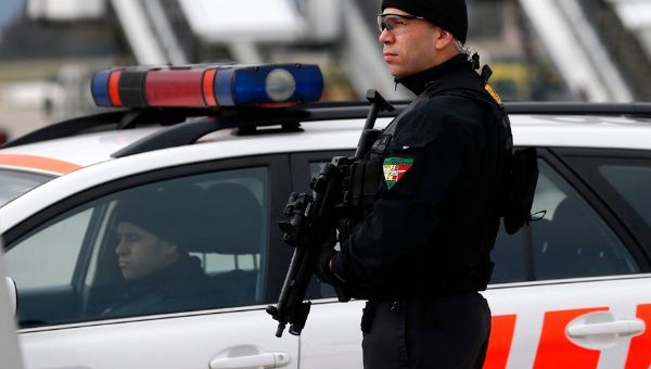 A Geneva police staff holds his position at Geneva International airport in Geneva, Dec.10, 2015.