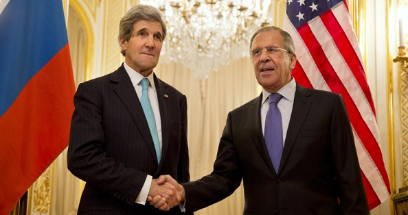 U.S. Secretary of State John Kerry (L) shakes hands with Russian Foreign Minister Sergey Lavrov.
