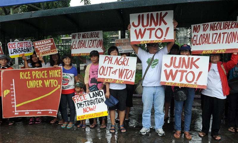 Activists hold a rally at the Philippine Department of Agriculture opposing the opening of the country’s agriculture market ahead of the WTO meeting in Nairobi.