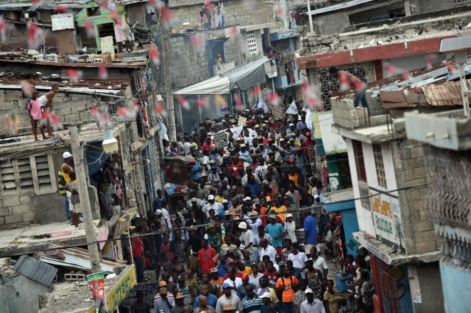 Opposition political parties march in protest against the Provisional Electoral Council, in Port-au-Prince.