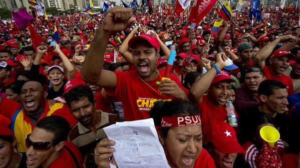 Supporters of Venezuelan President Hugo Chavez attend his campaign closure rally in Caracas, on October 4, 2012.