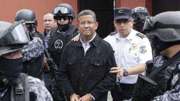 Francisco Flores being escorted by Salvadoran police