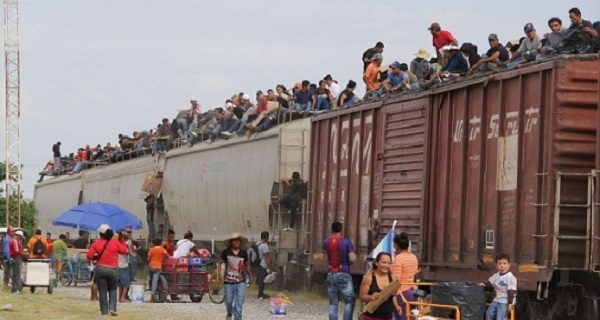 Migrants travel north through Mexico upon the infamous train known as “The Beast” to reach the United States.