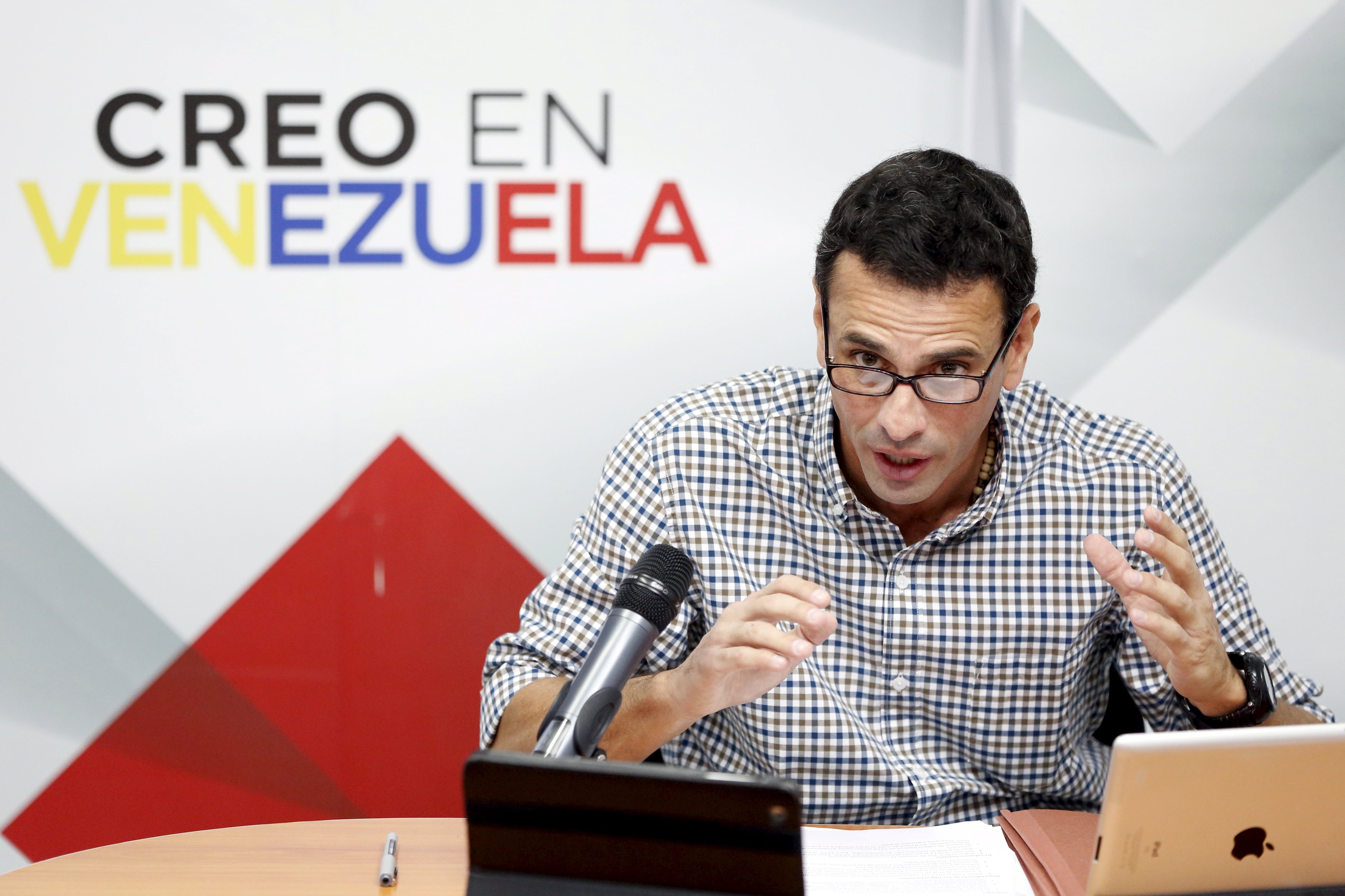 One of Venezuela's opposition leaders, Henrique Capriles talks to the media during a news conference in Caracas Dec. 21, 2015.