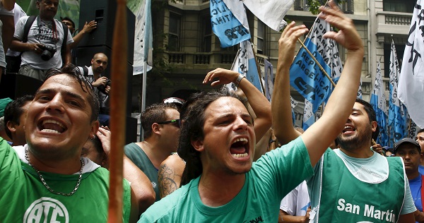 State workers protest outside the Labor Ministry demanding a halt in job cuts in Buenos Aires on Dec. 29, 2015.