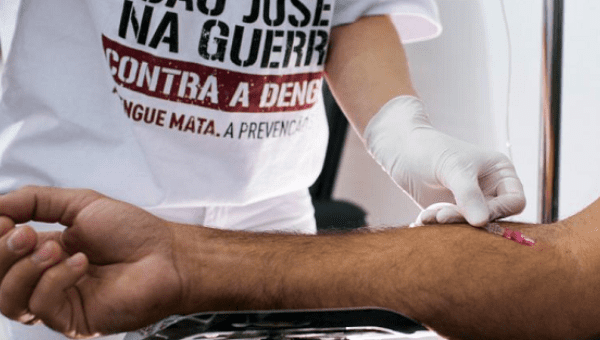 A nurse takes a blood sample to test for dengue fever, in a medical tent in Sao Jose dos Campos, Brazil, May 7, 2015.