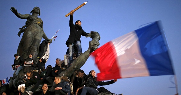 A man holds a giant pencil as he takes part in a solidarity march in the streets of Paris after theCharlie Hebdo shootings, France Jan. 11, 2015.