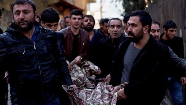 People carry body of Murat Ergul who died during the clashes between the Kurdistan Workers' Party and Turkish forces, in Sirnak city, Turkey, 10 Jan. 2016. 