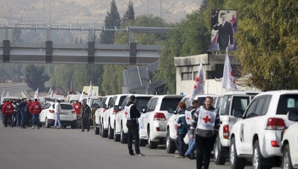 A convoy consisting of Red Cross, Red Crescent and United Nations gathers before heading toward Madaya, al Foua and Kefraya, Syria.